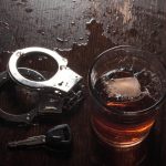 handcuffs and keys symbolizing drunk driving arrest